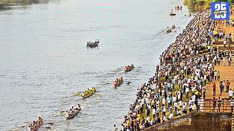 “Tarun Maratha team celebrates their victory in the traditional boat race as thousands watch from both banks of the Krishna River.”