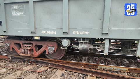 Railway staff working to lift the derailed goods train coach near Nandgaon, disrupting Central Railway traffic for over an hour.

