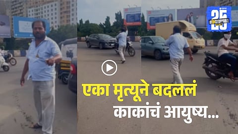 A Pune rickshaw driver managing traffic at Magarpatta Bridge to prevent accidents and save lives, becoming a local road safety hero