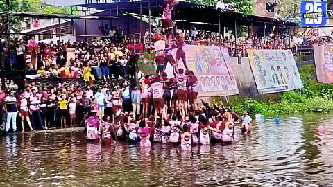 Govinda Pathak performing a five-tier water Dahi Handi pyramid in Wai’s Kivra stream.