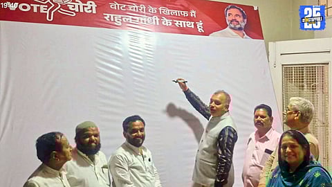 "Congress activists in Satara collecting signatures against vote theft, supporting Rahul Gandhi’s call for electoral integrity."