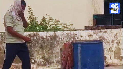 Police officials recover a 35-year-old man’s body from a blue plastic drum filled with salt on a house rooftop in Khairthal-Tijara, Rajasthan.