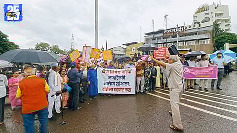 “Satara protest march: Senior citizens demand district-wide ban on loudspeakers amid heavy rain.”