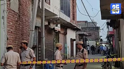 Police at the crime scene in Delhi’s Khark Riwada village where a youth brutally killed his parents and brother before fleeing.