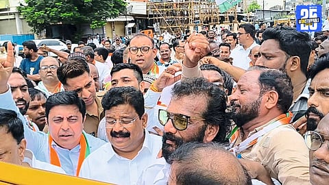 “Congress workers protesting in East Nagpur after blackening the MLA’s board; political tension in the area.”