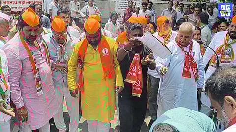 MVA leaders in Solapur burn Public Security Bill copies during a protest march against the state government.