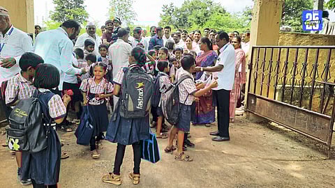 Students welcomed with roses as schools reopen after transfer dispute.