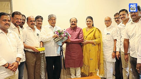 Chandrakant Patil addressing Mahayuti leaders, stressing unity and hard work for mayoral success.