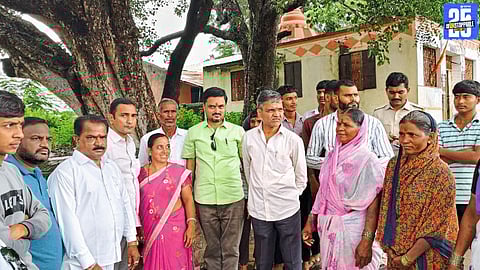 MP Nilesh Lanke inspecting crop losses in Pathardi; assures farmers of full support.