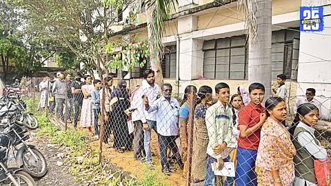 Students wait in long queues outside closed Aadhaar enrollment centers in Ahilyanagar.