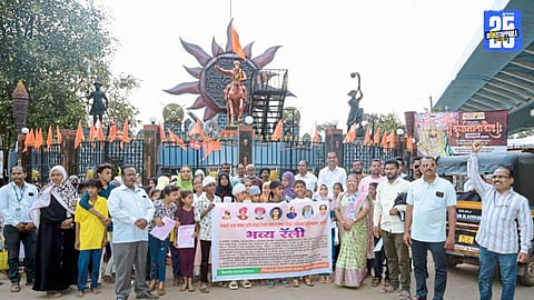 Participants raise slogans in Ahilyanagar rally demanding free education as a basic right.