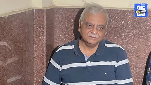 Retired IAS officer Alok Shukla waiting outside Raipur court, seeking arrest in connection with the Chhattisgarh Nan scam case.