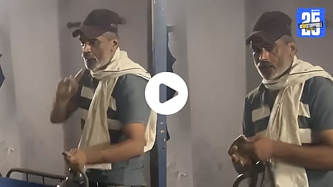 Constable Santosh holding a cobra moments before being fatally bitten during a viral incident in Indore.