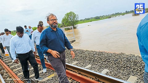 "Solapur district flooded; railway tracks submerged and ST services disrupted, causing heavy losses."