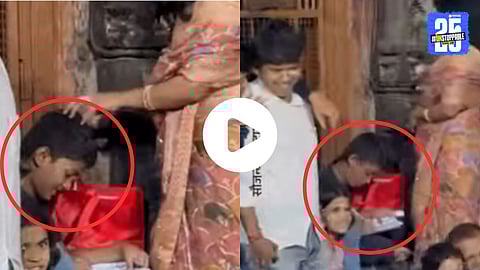 A student studies with books during a noisy palkhi procession at Navratri, leaving onlookers surprised.