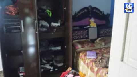 Police inspecting the Tembhurni house where thieves broke the door, assaulted a resident, and looted jewellery.