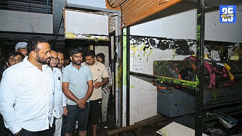 Minister Jaykumar Gore interacting with disaster-affected families in Mhaswad during heavy rains.