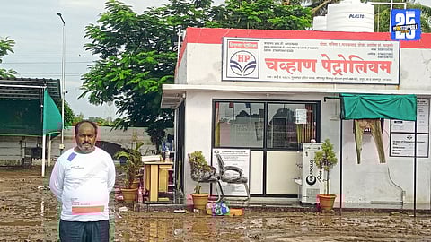 Rescue team saving a man trapped for 14 hours on the roof of Chavan Petrol Pump in Hattur.