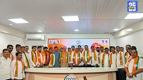 Manoj Ghorpade with new BJP entrants from Koparde Haweli group; a political setback for former minister Balasaheb Patil.