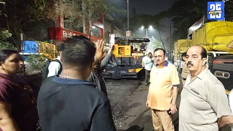 MLA and BJP District President inspect Ulhasnagar night road repair drive using mastic asphalt; civic workers in action.