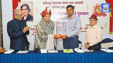 Vikrant Ajagawkar proudly receiving the Keshavrao Bhosale Kaladarsh Award for his remarkable contributions to Marathi arts.