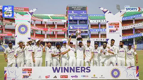 Shubman Gill hands over the Test series trophy to Narayan Jagadeesan after India’s win against West Indies.