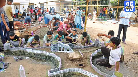 Volunteers display 45 miniature forts at Shiv Smarak during the inauguration of the fort-building competition, with Indalkar family descendants present.