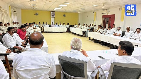 Former minister Balasaheb Thorat interacting with Congress leaders during a meeting; workers unanimously demand independent contest in upcoming elections