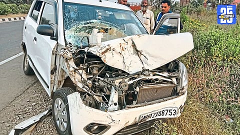 Wrecked car and tempo at the Solapur-Pune Highway accident site after tyre burst; woman critically injured.