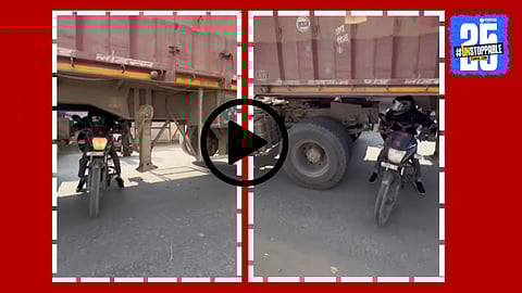 A man astonishingly rides his bike from under a truck stuck in Bihar traffic, a moment that quickly went viral on social media.