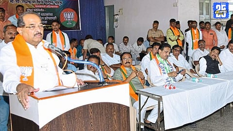 Guardian Minister Radhakrishna Vikhe Patil addressing a gathering, assuring 100% rehabilitation for displaced families.