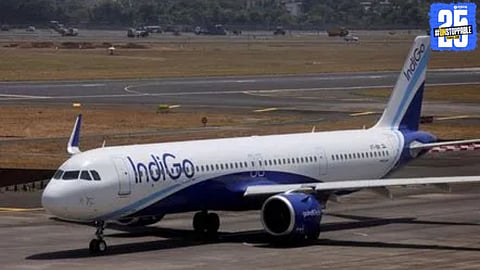 Indigo aircraft seen after making an emergency landing at Ahmedabad Airport following a reported bomb threat, prompting full security inspection.