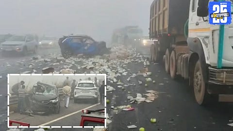 Damaged vehicles and emergency response teams at the site of a major accident on the Delhi Mumbai Expressway involving multiple vehicles.