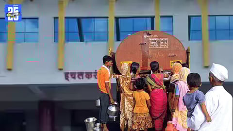 Residents queue up for water amid disrupted supply during election season.