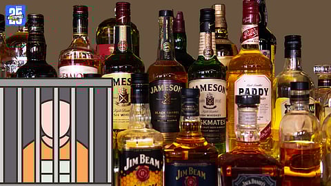 Police display seized foreign liquor and tempo during Kolhapur operation.