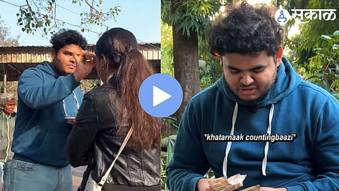 A young man applying fragrance to devotees outside a temple, an activity that went viral on social media for its unique earning concept.