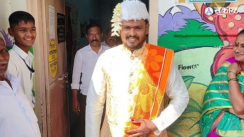 Groom arrives at polling booth straight from his wedding mandap to exercise his voting right.