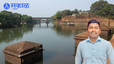 A rescuer dives into the Panchganga River to save a young girl