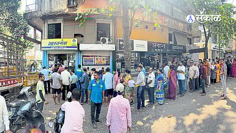Citizens stand in long queues