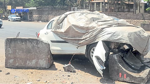 A damaged car remains stuc