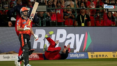 Phil Salt celebrates after a stunning catch as Ishan Kishan walks back after missing his century