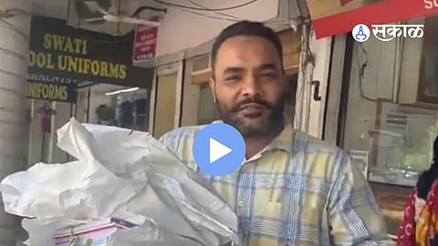 A concerned parent holding a stack of school books and a ₹9,000 bill highlights the rising cost of education materials in Chandigarh.