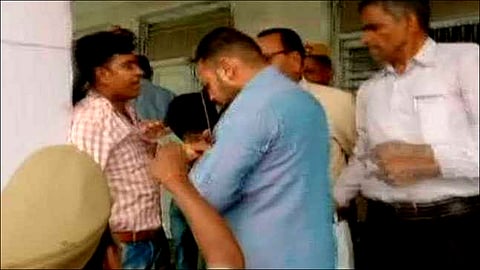 BJP Workers Thrash UP Polling Officer For Asking Voters To Press Cycle