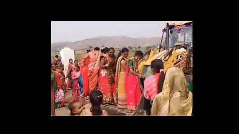 women using a jcb in the most indian jugaad