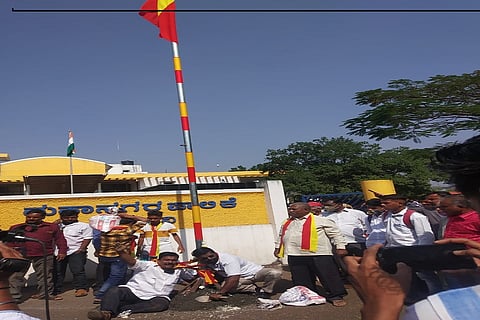 activist waved a red and yellow flag in front of the Municipal Corporation under police protection belgaum