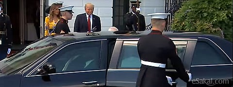 US guard opening the left door of the car expecting Mrs Modi?