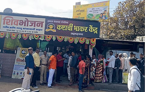 Queue for a Shiva meal plate in nagar