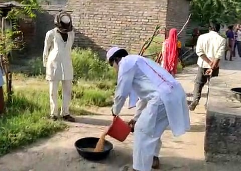 The teacher distributed eight sacks of grain in the field