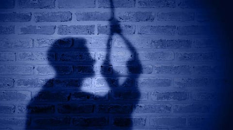 commits suicide by hanging himself