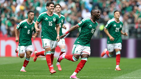 Julian Quinones #16 of Mexico celebrates with teammates after scoring the team's first goal during the FIFA World Cup 2026 Group A match between Mexico and South Africa at Mexico City Stadium on June 11, 2026 in Mexico City, Mexico.